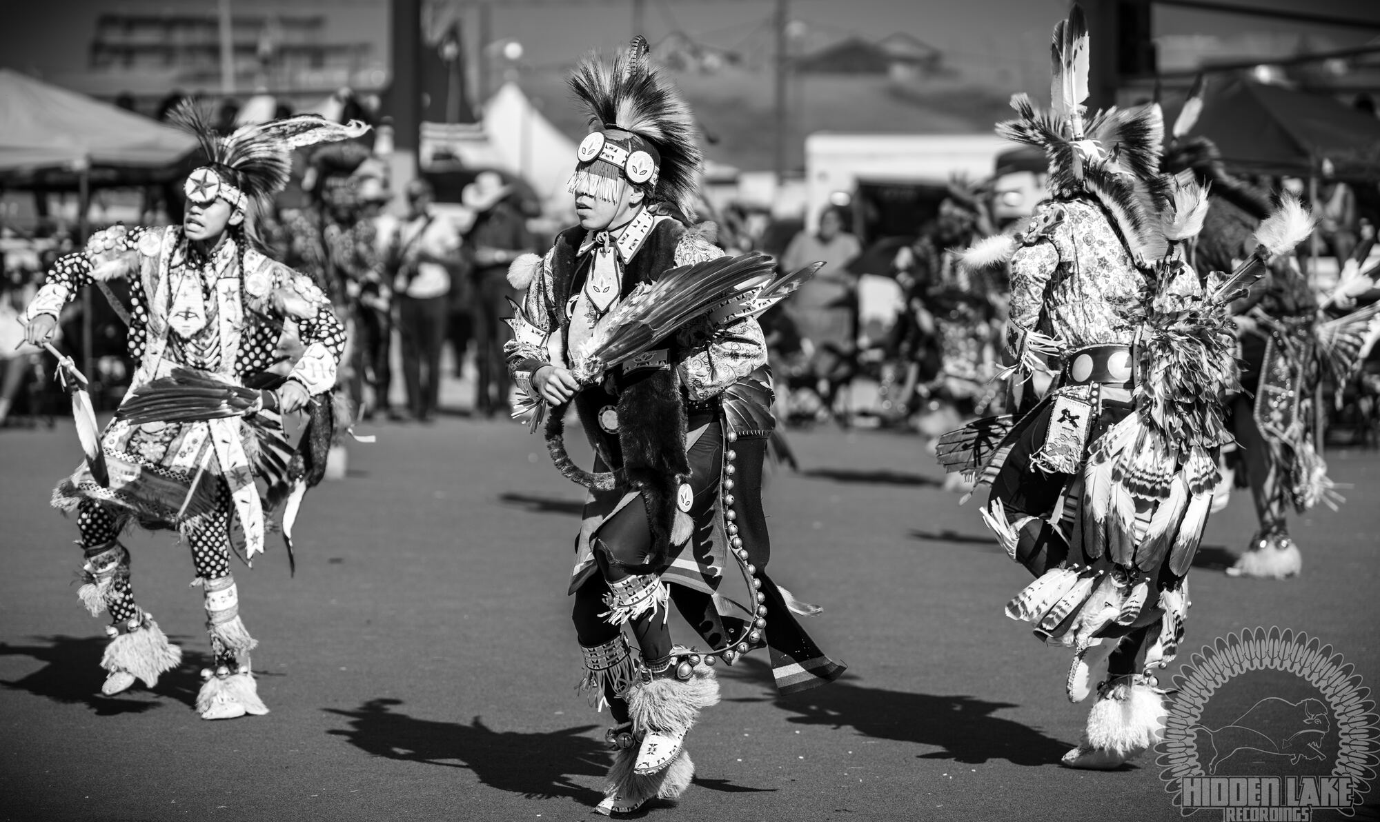 Men's traditional dancers in the arena, black and white