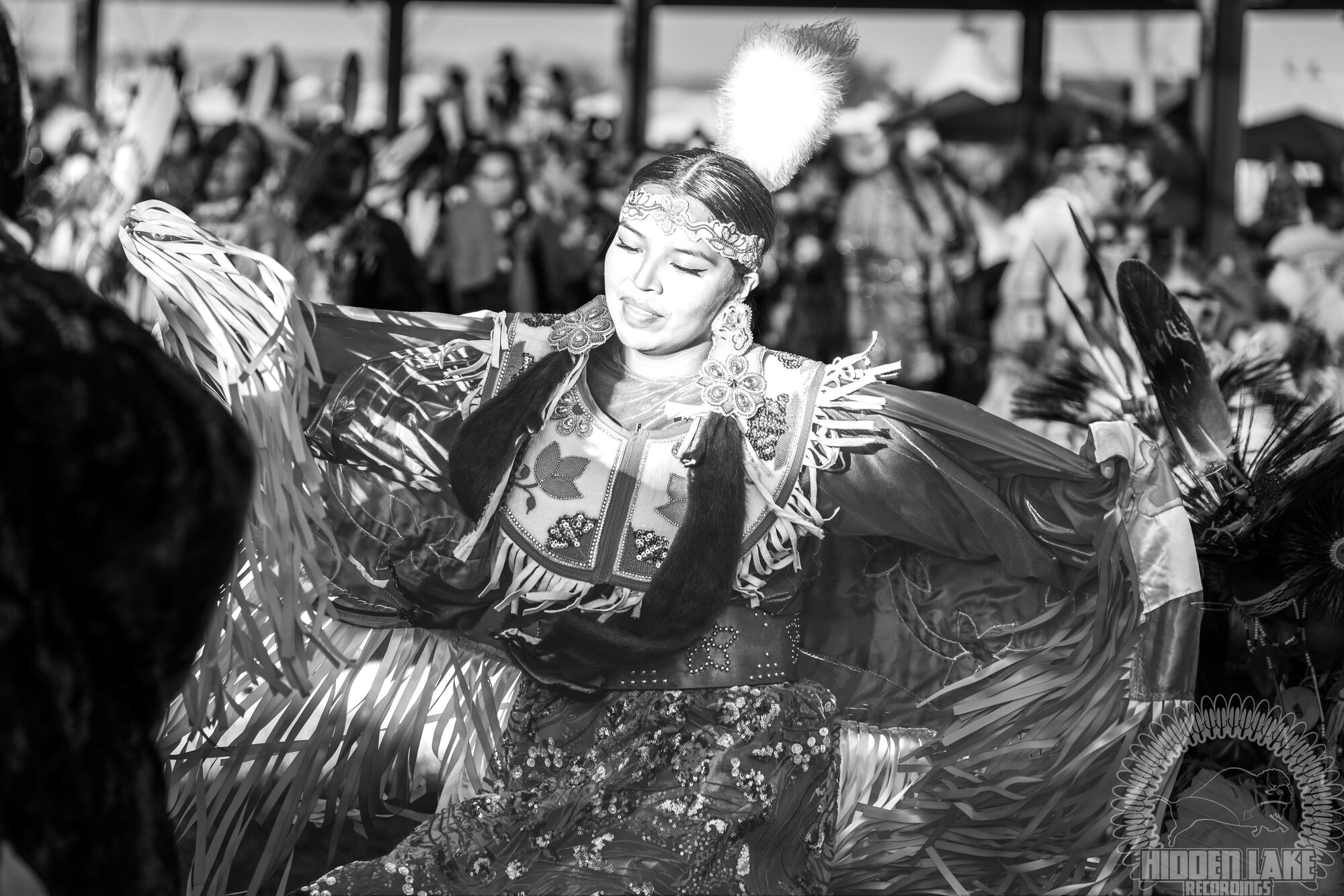 Jingle dress dancer in motion, black and white